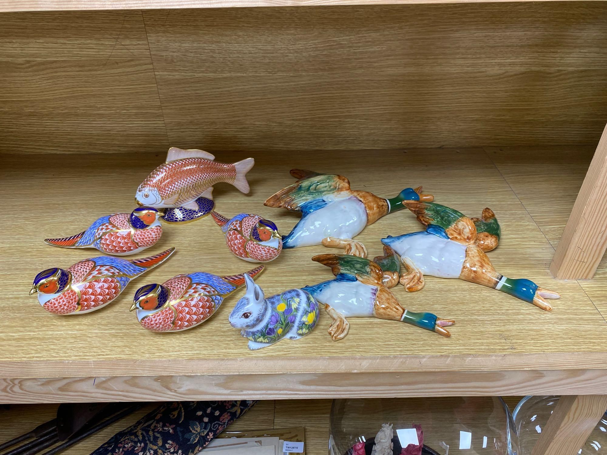 A graduated set of Beswick flying ducks and five Royal Crown Derby animal paperweights and another similar rabbit, fish 18cm